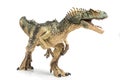 Allosaurus plastic figurine on white background