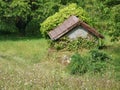 Allotments on the edge of the forest with nice garden house with brick cover Royalty Free Stock Photo