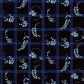 Allover flowers on black and blue plaid. seamless design. Royalty Free Stock Photo