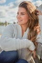 Allow peace to flow into you as sunshine flows through trees. a beautiful young woman relaxing outdoors. Royalty Free Stock Photo