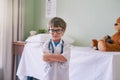 Allow your child to develop his own interests. an adorable little boy dressed as a doctor. Royalty Free Stock Photo