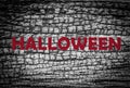 Alloween text on grungy wood background