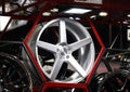 Alloy Wheel of car on the shelf with red Hexagon frame. Royalty Free Stock Photo