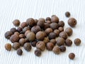 Allspice background. Handful of Jamaican pepper, pimento berry or myrtle pepper Royalty Free Stock Photo