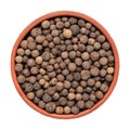 Allspice in a bowl isolated on white background. Top view. Peppercorns Royalty Free Stock Photo