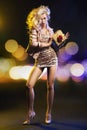 Alluring fit lady holding tiny gift Royalty Free Stock Photo