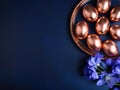 Golden Easter Eggs and Elegant Iris Flowers on a Dark blue background Royalty Free Stock Photo