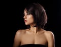 Alluring portrait of short bob hair style woman looking down on black background. Closeup portrait