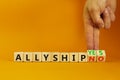 Allyship yes or no symbol. Concept words Allyship yes or Allyship no on wooden cubes. Businessman hand. Beautiful orange table