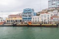 View of Buildings on river bank of Tagus river at Cacilhas district. View from Tagus river