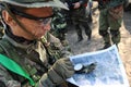 Almaty, Kazakhstan - 06.29.2013 : The airsoft player looks at the location of the posts on the map