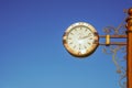 Almaty, Kazakhstan - August 17, 2023: A large outdoor clock from Omega hangs on a pole