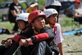 Almaty, Kazakhstan - 04.27.2013 : Children in gear look at the climbing trail. Eco-festival on the banks of the Ili River