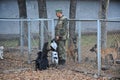 Almaty, Kazakhstan - 11.04.2014 : A dog handler prepares for training with a service dog