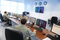 Almaty, Kazakhstan - 11.20.2015 : Employees of the mission control center of the KAZSAT satellite monitor telemetry data