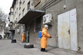 Almaty / Kazakhstan - 03.26.2020 : a man in a special suit handles the entrances of houses in the city