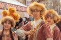 Young guys and a girl in national Kazakh clothes during a festive performance in the city