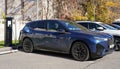 Almaty, Kazakhstan - November 11, 2023: The BMW iX xDrive40 is recharged at an electric vehicle station