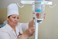 Almaty / Kazakhstan - 05.15.2012 : The nurse puts a drip on the patient. Medical solution - plasma replacement agent