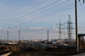 Almaty, Kazakhstan - 02.04.2021 : Power lines on the background of a large layer of smog covering the city and mountains Royalty Free Stock Photo