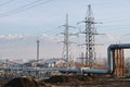 Almaty, Kazakhstan - 02.04.2021 : Power lines on the background of a large layer of smog covering the city and mountains Royalty Free Stock Photo