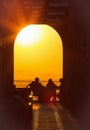 Almaty, Kazakhstan, 05.2017. Silhouettes of having a rest on a cafe terrace in Kok Tobe Park at sunset