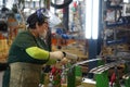 Almaty, Kazakhstan - 02.15.2022 : The worker applies an adhesive agent for soldering car parts. Hyundai Factory