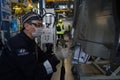 Almaty, Kazakhstan - 02.15.2022 : A worker applies an adhesive agent for soldering car parts. Hyundai Factory