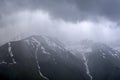 Almaty mountains with cloudy stormy clouds.