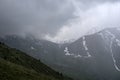 Almaty mountains with cloudy stormy clouds.