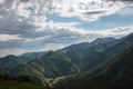 Almaty mountains with cloudy stormy clouds. Overcast - weather storm. Royalty Free Stock Photo