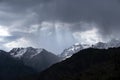 Almaty mountains with cloudy stormy clouds. Overcast - weather storm. Royalty Free Stock Photo