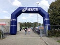 Blue Asics inflatable start or finish arch.
