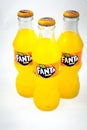 Almeria, Spain; November 25th, 2021: Three 200ml Orange flavoured Fanta bottles, Classic glass bottles with metal cap