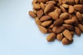 Almond. Almonds whole. On a white background on one side are nuts. Royalty Free Stock Photo