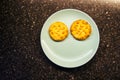 Almond biscuits on a blue plate