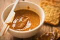 Almond butter in bowl with crackers Royalty Free Stock Photo