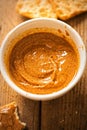 Almond butter in bowl with crackers Royalty Free Stock Photo