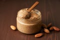 Almond butter, raw food paste made from grinding almonds into nut butter, side view Royalty Free Stock Photo