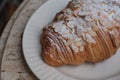 almond croissant on white dish