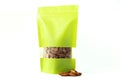 Almond filled plain green paper doypack stand up eco friendly bag with window zipper on white background