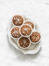 Almond flour muffins with pearl sugar on a plate on a light background, top view Royalty Free Stock Photo