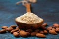 Almond flour in a wooden spoon