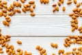 Almond frame on white wooden background top view space for text Royalty Free Stock Photo