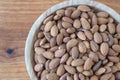 Almond kernel in a bowl. Background view from above. Healthy food.