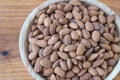 Almond kernel in a bowl. Background view from above. Healthy food.