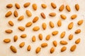 Almond kernels background on beige table top-down Royalty Free Stock Photo