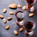 Almond liquor amaretto on a grunge black table Royalty Free Stock Photo