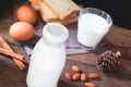 Almond milk bottle and glass, sliced breads and boiled eggs