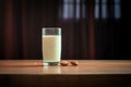 almond milk in a clear glass with backlit glowing effect